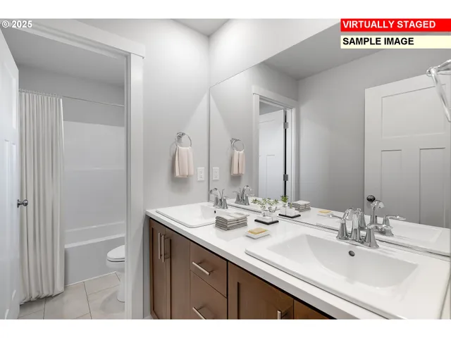 a bathroom with a sink double vanity and a mirror