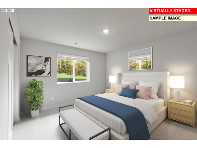 a bedroom with a bed and a painting on the wall