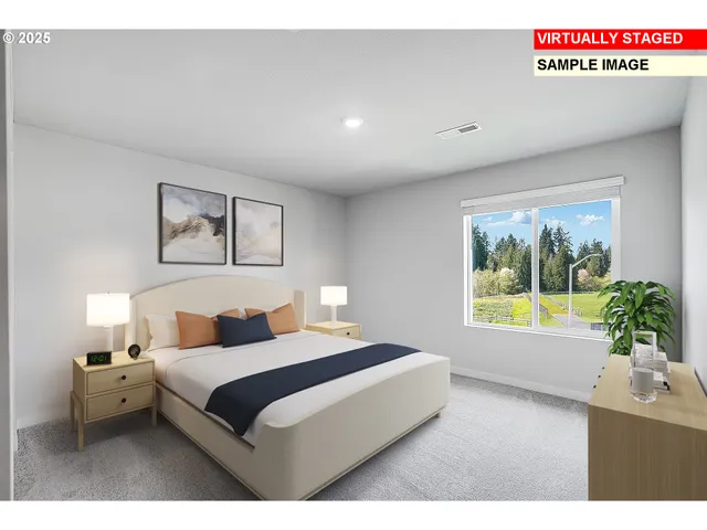 a bedroom with a large bed and a large window