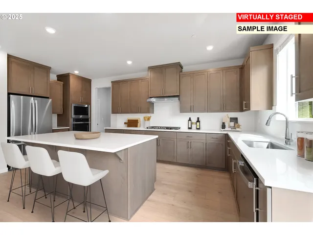 a kitchen with a sink cabinets and counter space