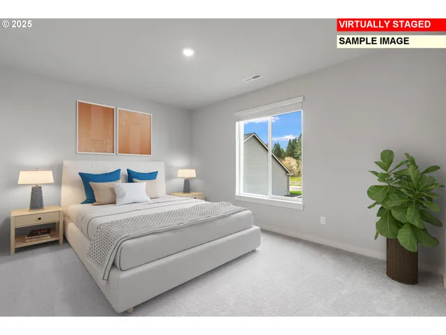 a bedroom with a bed and a potted plant