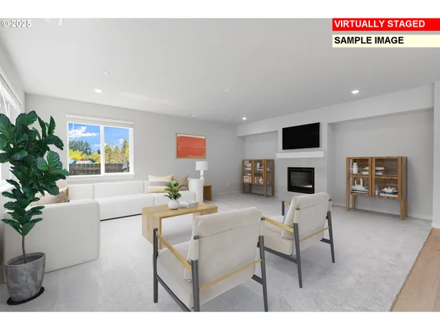 a living room with furniture a fireplace and a potted plant