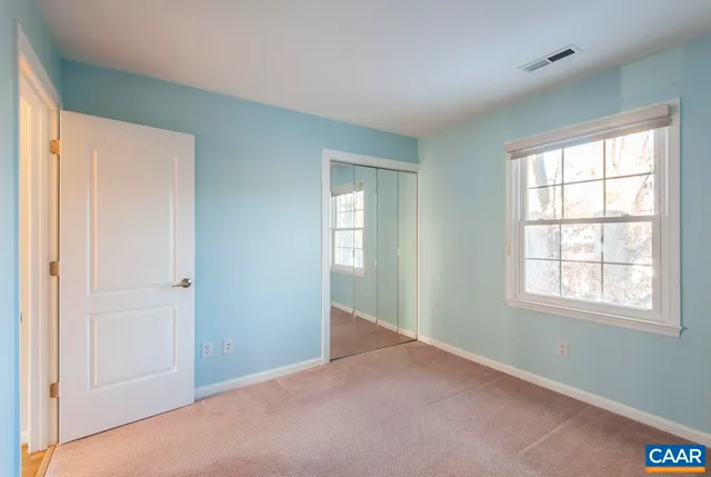 a front view of a house with parking space