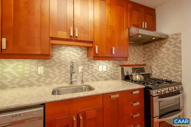 a view of a hallway with washer and dryer