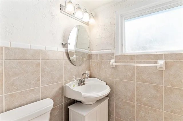 a view of a house with swimming pool and sitting area