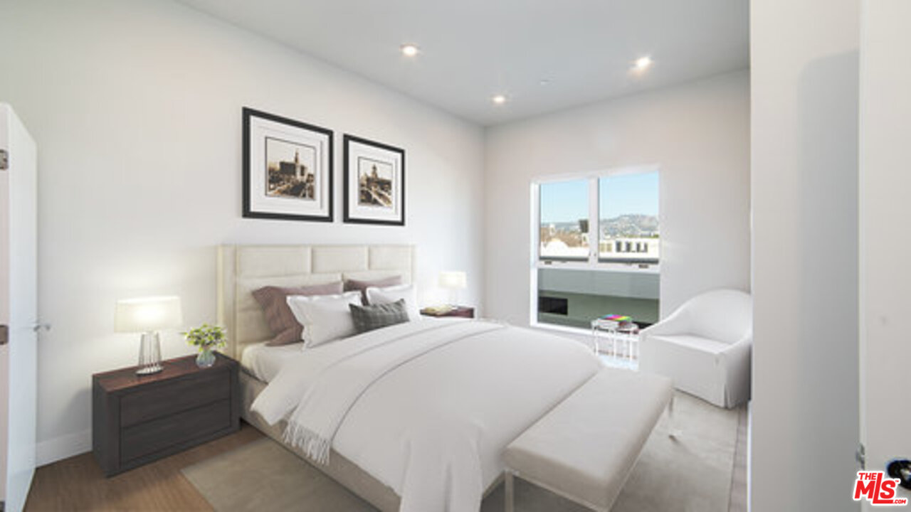 909 Le Doux Road, Unit 403 Los Angeles, CA 90035 - Photo 14 of 28 a bedroom with a bed and a couch