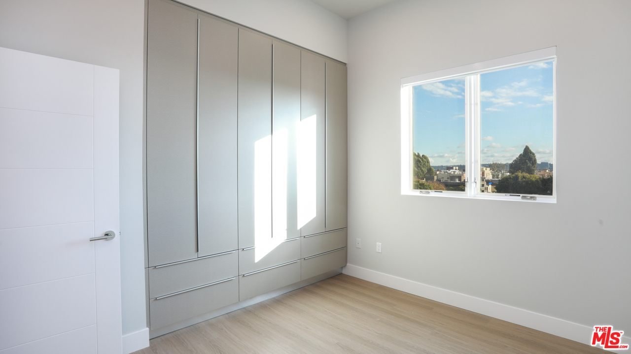 909 Le Doux Road, Unit 403 Los Angeles, CA 90035 - Photo 16 of 28 a view of an empty room with a window