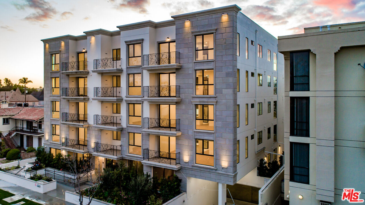 909 Le Doux Road, Unit 403 Los Angeles, CA 90035 - Photo 23 of 28 a front view of a building with glass windows