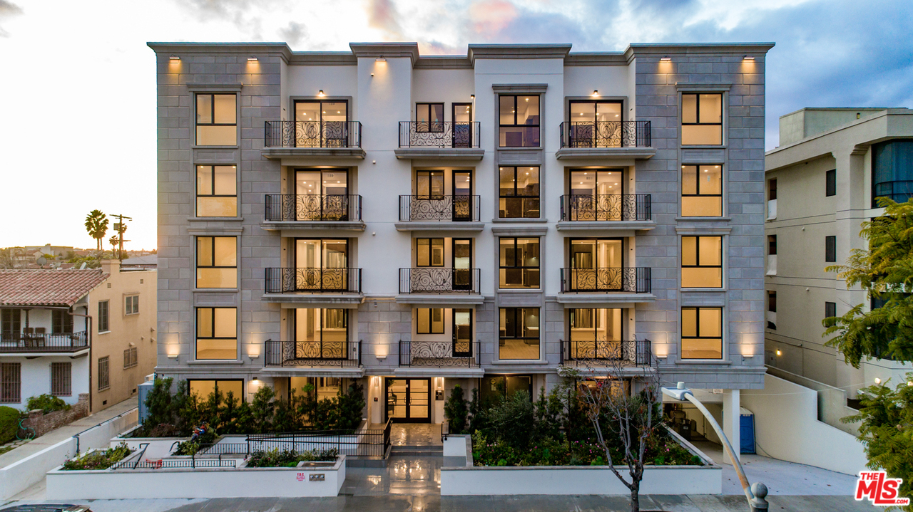 909 Le Doux Road, Unit 403 Los Angeles, CA 90035 - Photo 24 of 28 a view of front red brick building