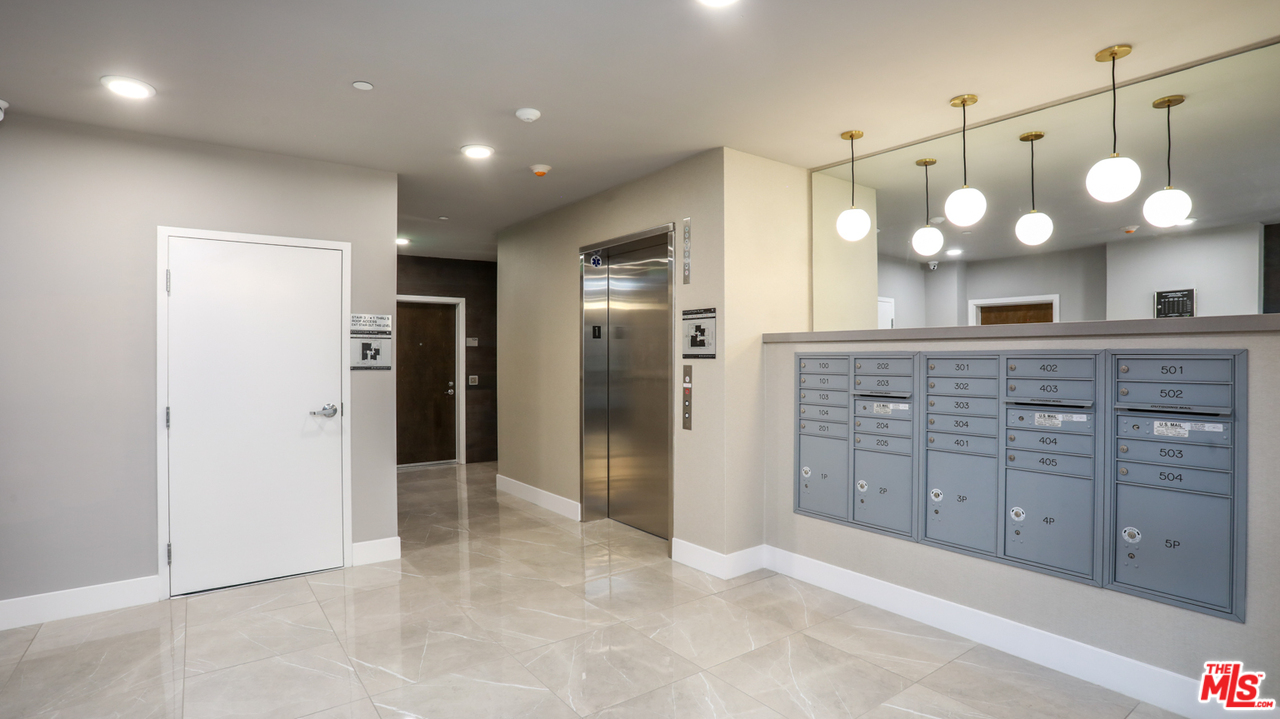 909 Le Doux Road, Unit 403 Los Angeles, CA 90035 - Photo 28 of 28 a view of a kitchen with a sink and cabinets