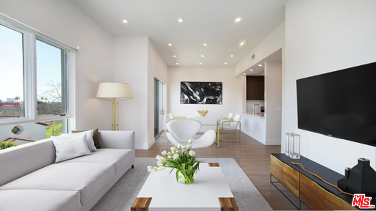 909 Le Doux Road, Unit 403 Los Angeles, CA 90035 - Photo 7 of 28 a living room with furniture and a flat screen tv