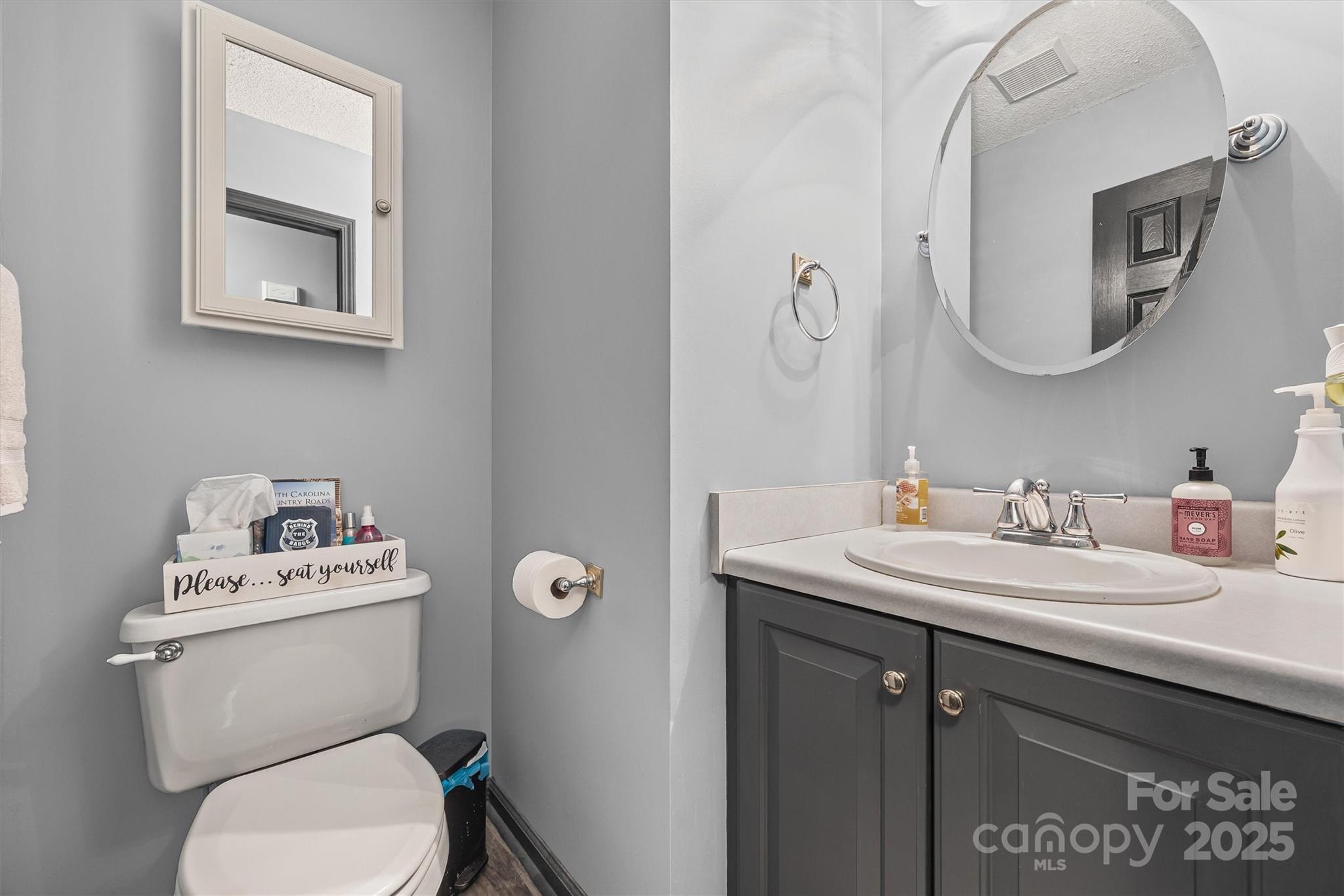 1975 Kehl Road Clover, SC 29710 - Photo 21 of 28 a bathroom with a toilet sink and mirror