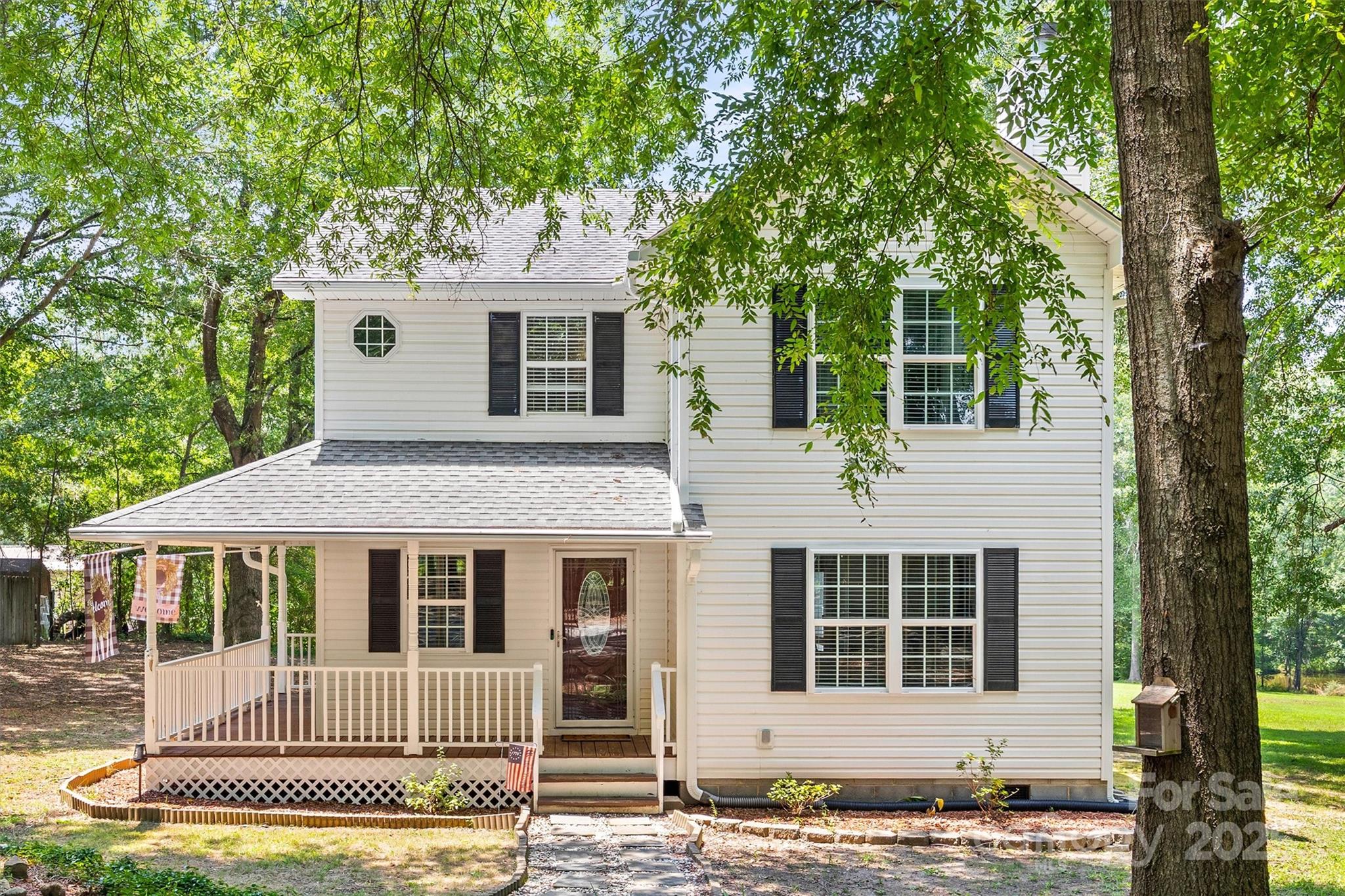 1975 Kehl Road Clover, SC 29710 - Photo 4 of 28 a front view of a house with a garden