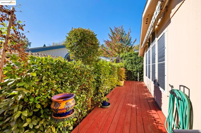 a backyard of a house with table and chairs