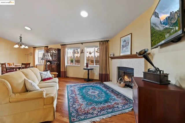 a living room with furniture or couch and a fireplace