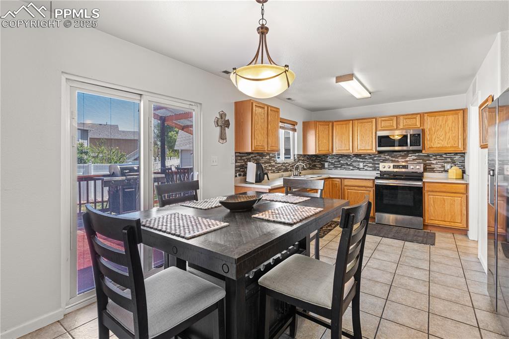 2000 Toronto Street Pueblo, CO 81004 - Photo 6 of 25 a view of a dining room with furniture window and outside view