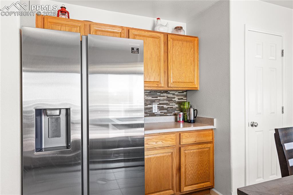 2000 Toronto Street Pueblo, CO 81004 - Photo 9 of 25 a kitchen with a refrigerator and a sink