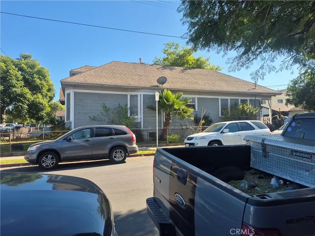 a view of street with parked cars