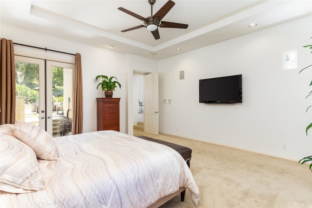 1785 North Kimbark Lane Orange, CA 92869 - Photo 17 of 35 a bedroom with a bed and a flat screen tv