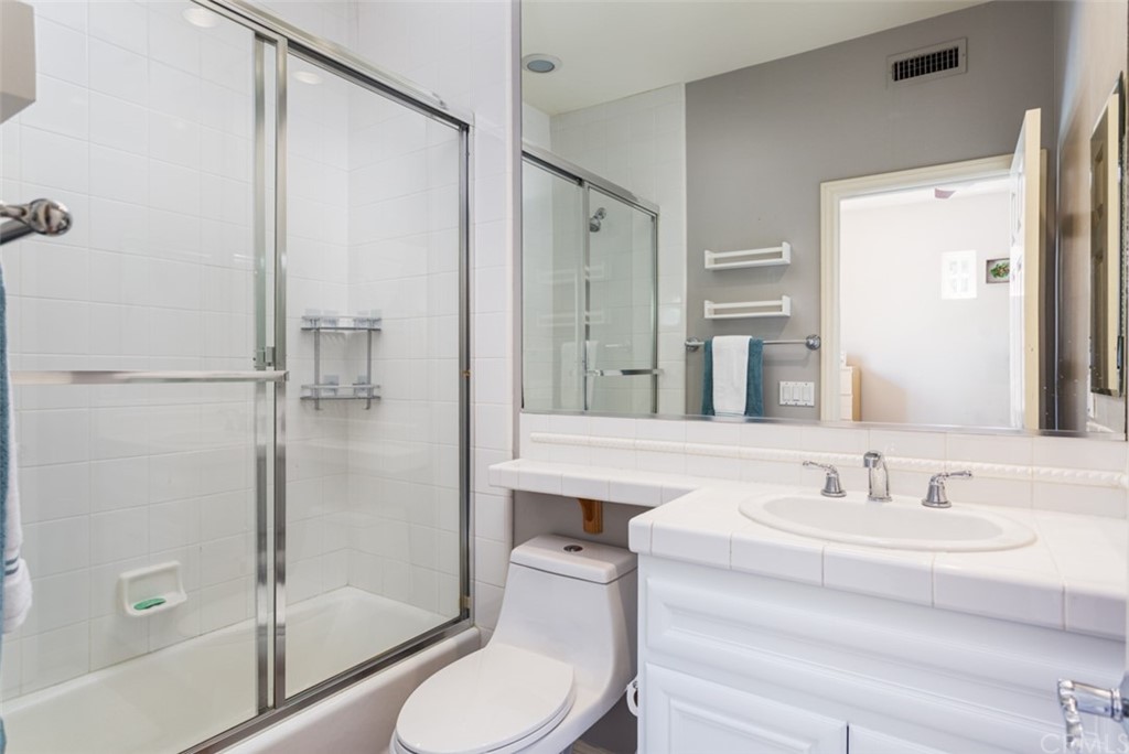 1785 North Kimbark Lane Orange, CA 92869 - Photo 21 of 35 a bathroom with a sink toilet and shower