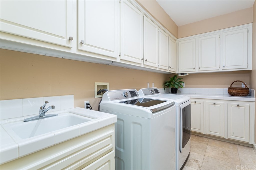 1785 North Kimbark Lane Orange, CA 92869 - Photo 25 of 35 a utility room with sink dryer and washer