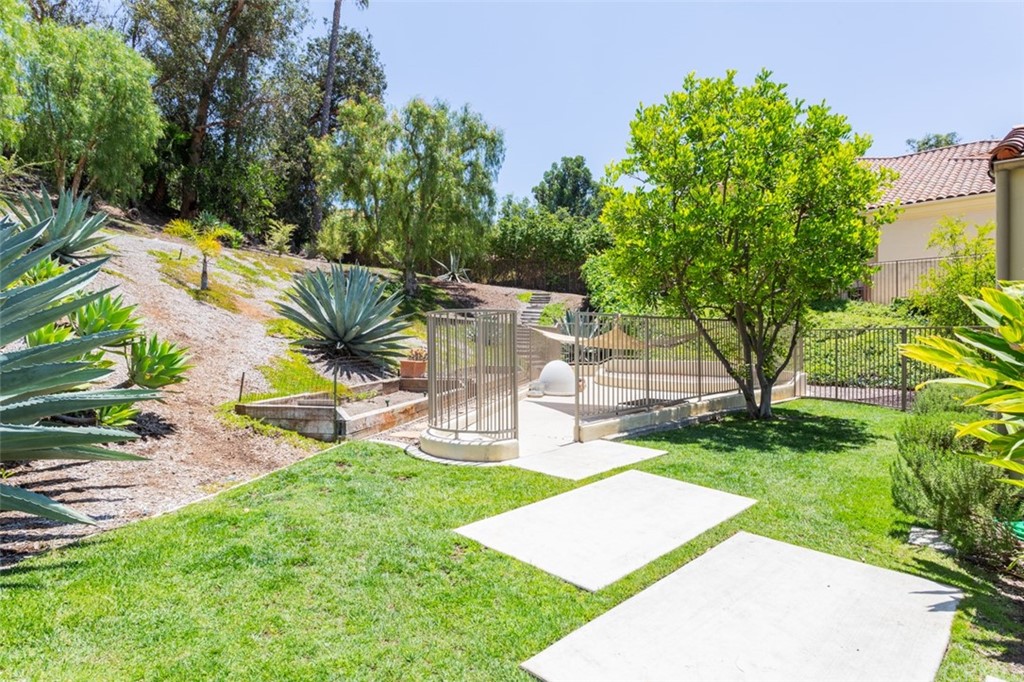 1785 North Kimbark Lane Orange, CA 92869 - Photo 34 of 35 a view of a backyard with a garden and sitting area