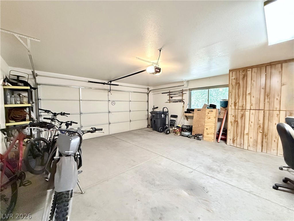 1220 East Gamebird Road Pahrump, NV 89048 - Photo 36 of 49 Functional 2 car garage with ample space and a convenient garage door opener for easy access.
