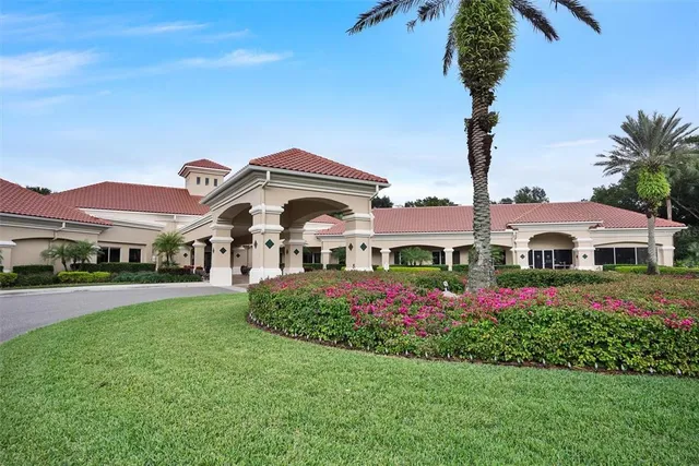 an aerial view of residential houses with outdoor space and river
