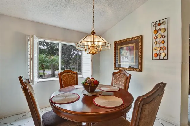 a kitchen with stainless steel appliances granite countertop a sink a stove and refrigerator