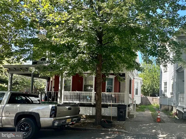a view of a car parked in front of a house