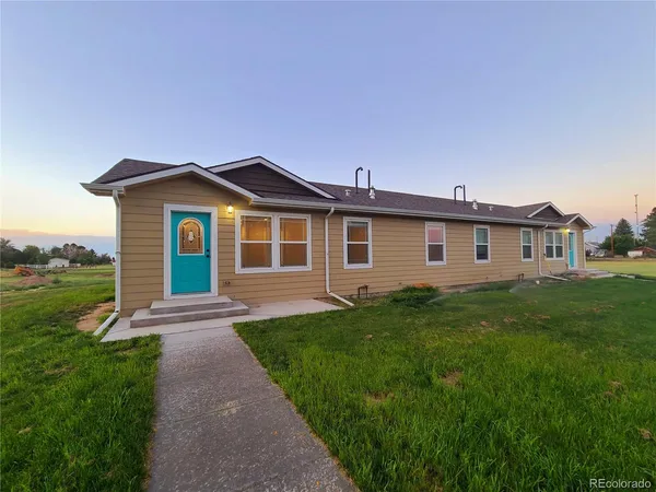 a front view of a house with yard