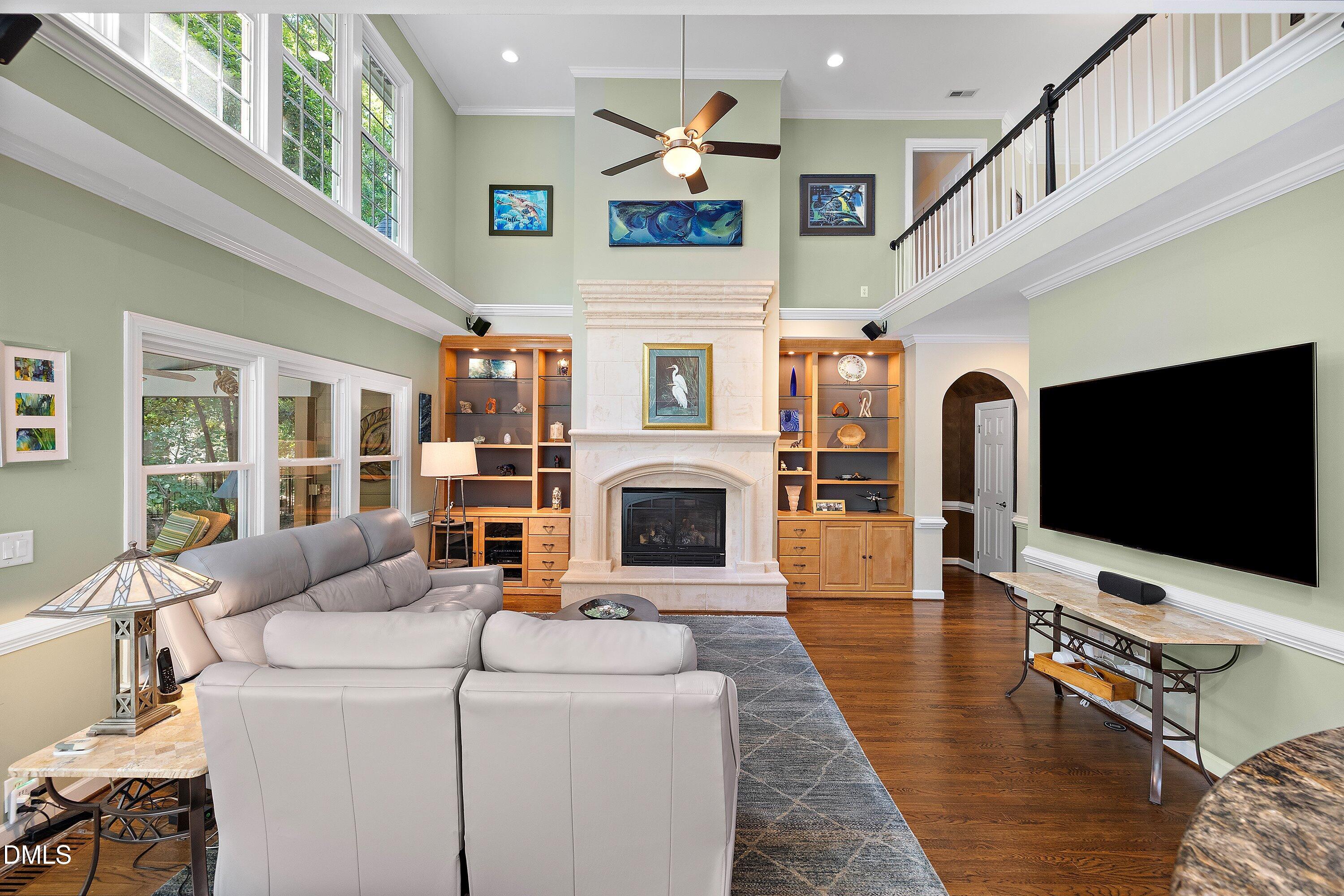 3608 Summer Leaf Court Raleigh, NC 27615 - Photo 13 of 63 a living room with furniture and a flat screen tv