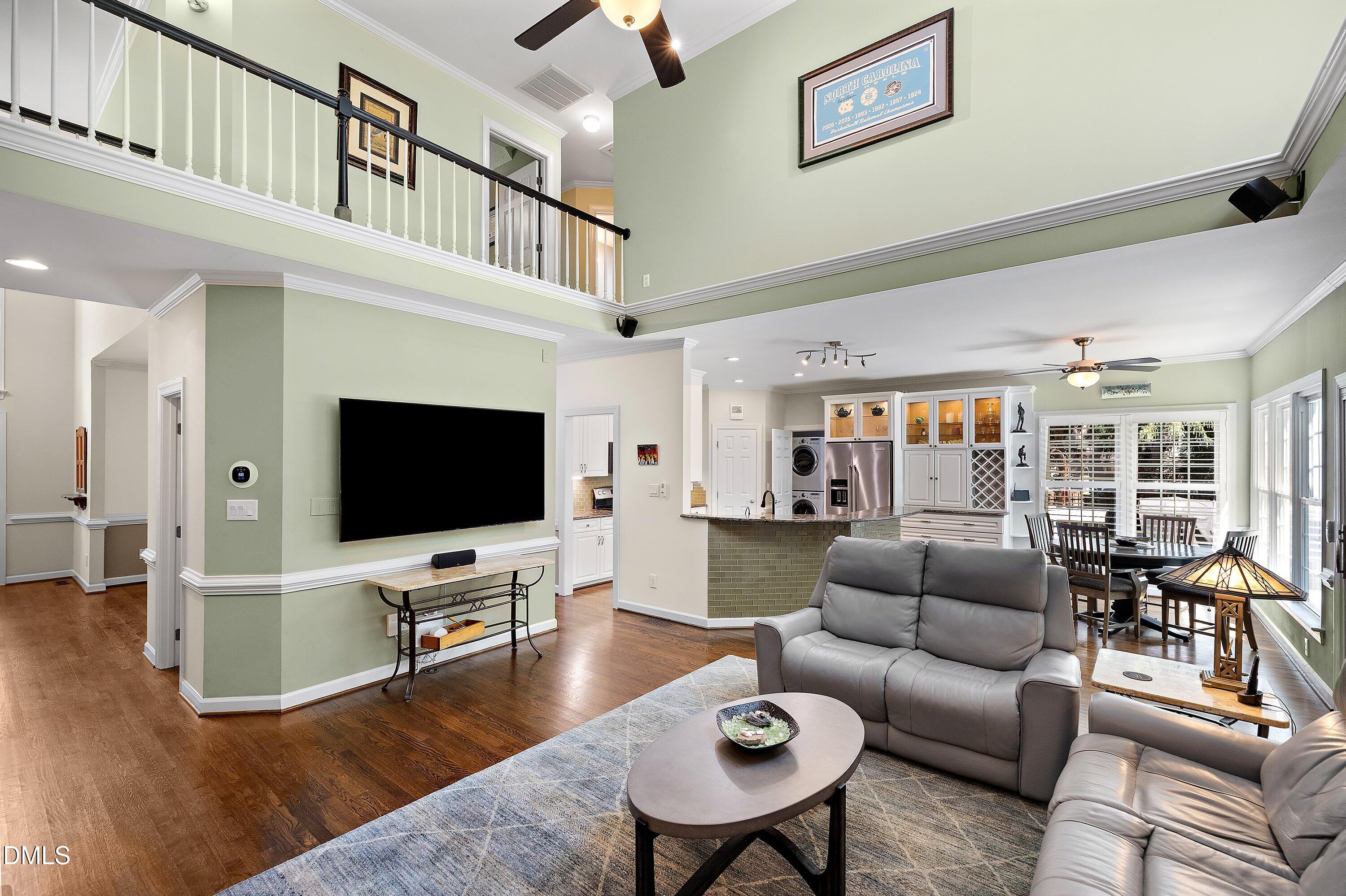 3608 Summer Leaf Court Raleigh, NC 27615 - Photo 15 of 63 a living room with furniture and a flat screen tv