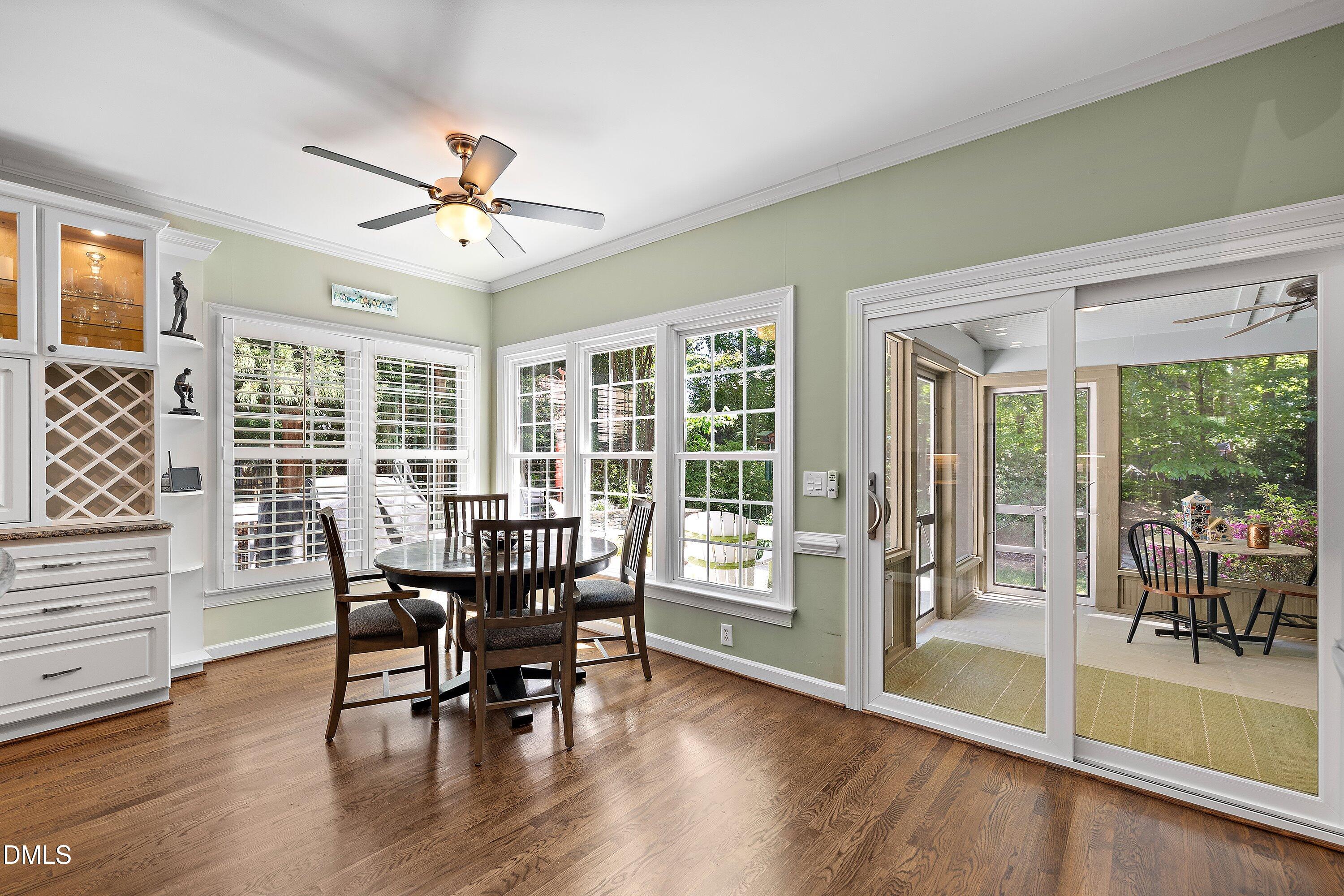 3608 Summer Leaf Court Raleigh, NC 27615 - Photo 16 of 63 a view of a dining room with furniture window and wooden floor