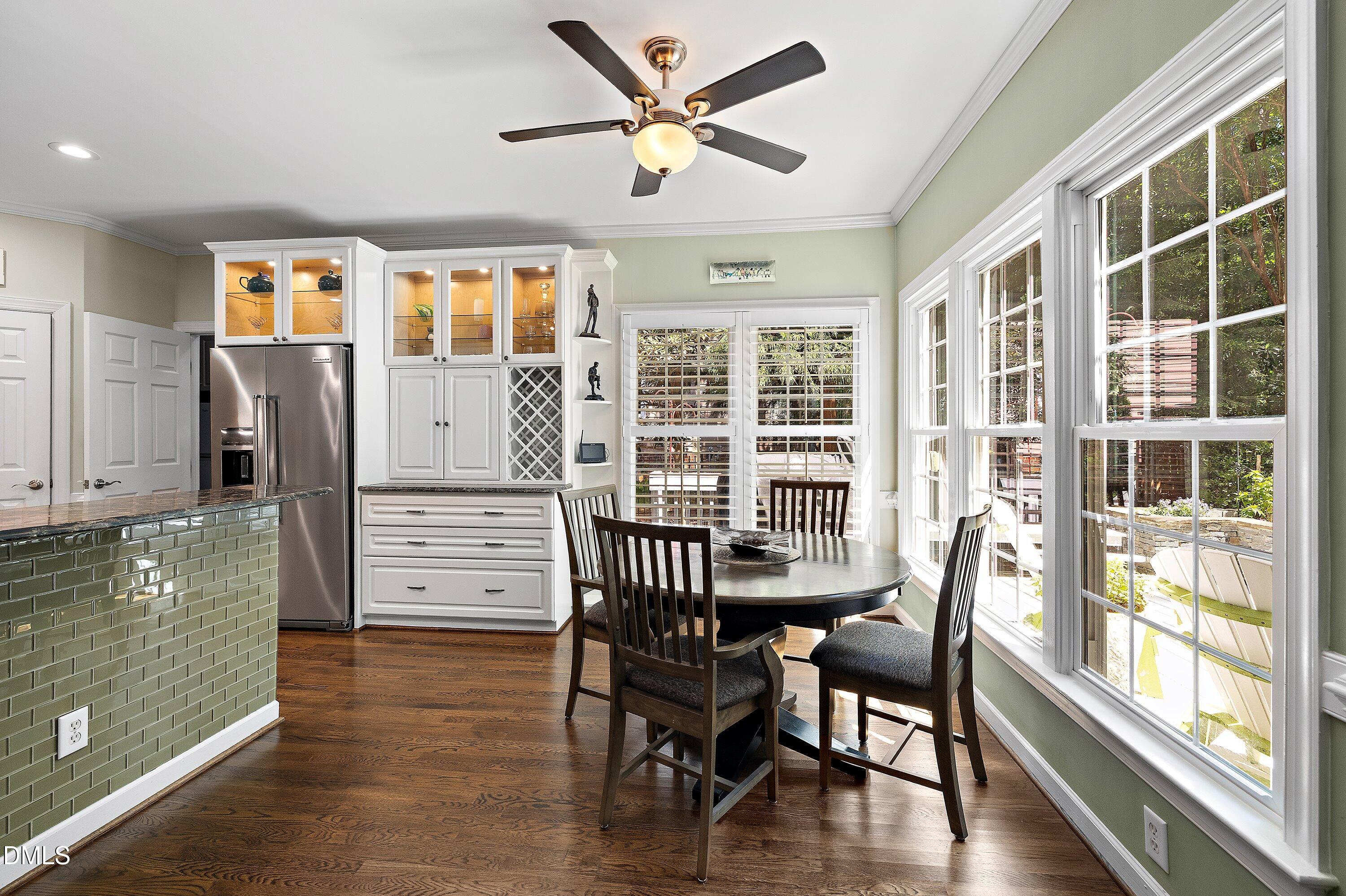 3608 Summer Leaf Court Raleigh, NC 27615 - Photo 17 of 63 a view of a dining room with furniture window and wooden floor