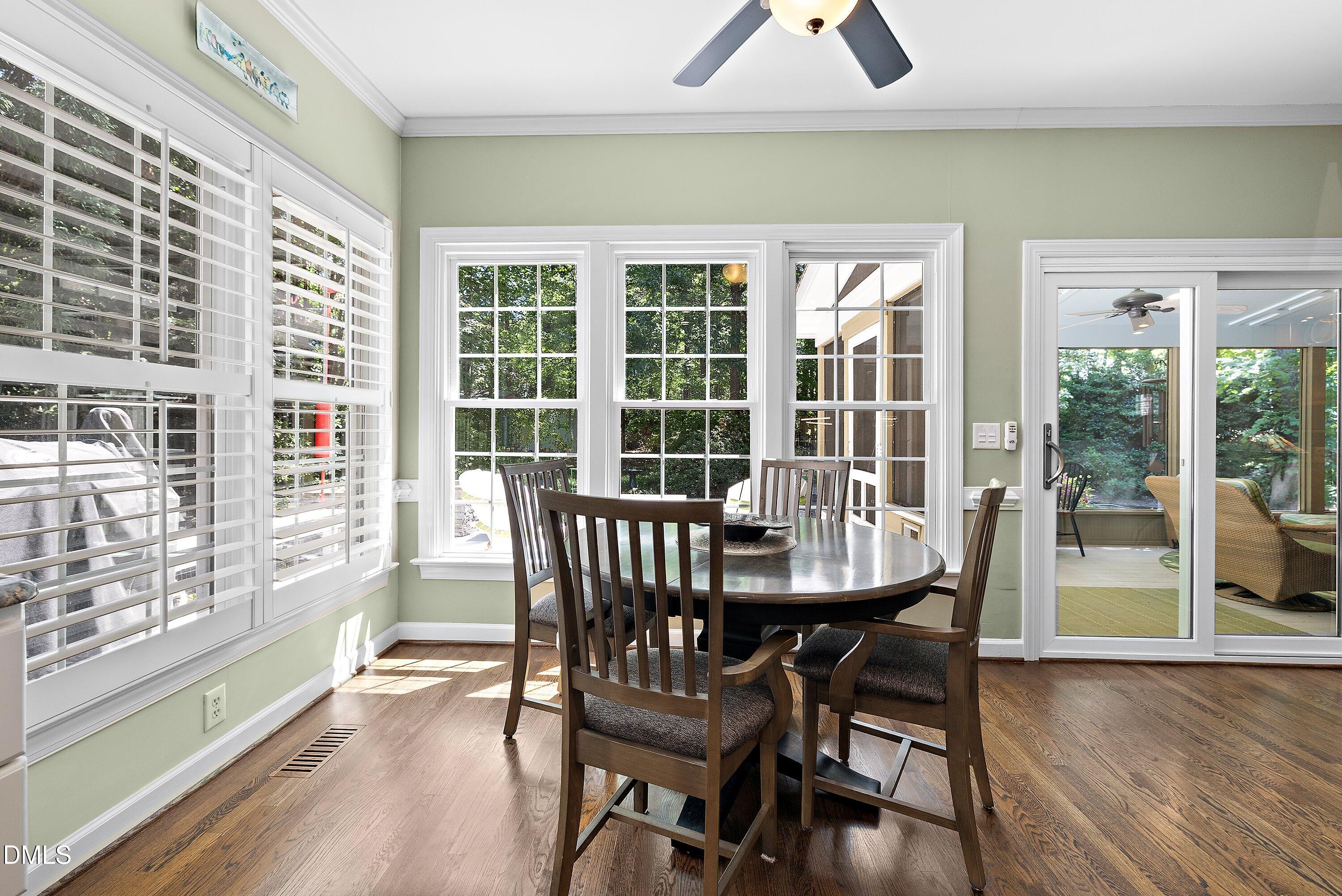 3608 Summer Leaf Court Raleigh, NC 27615 - Photo 27 of 63 a view of a dining room with furniture window and wooden floor