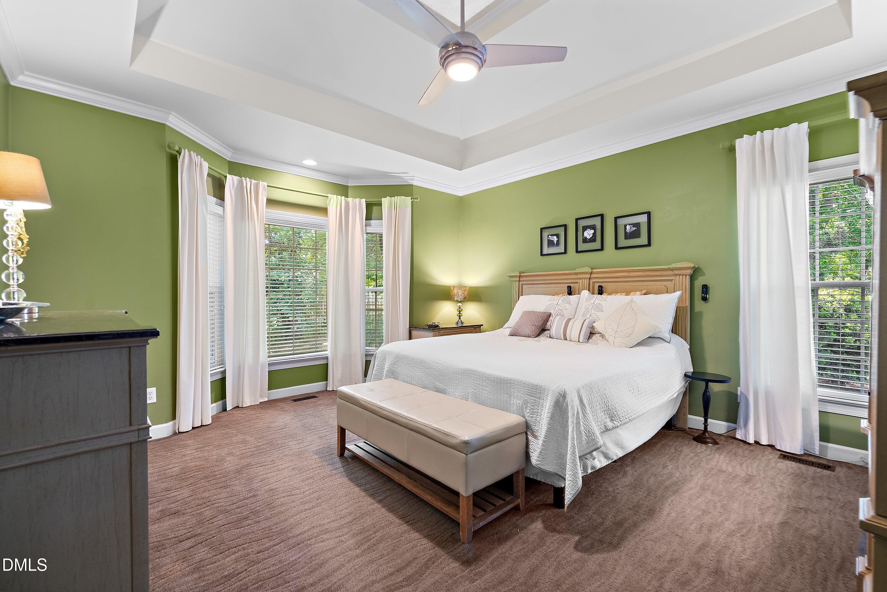3608 Summer Leaf Court Raleigh, NC 27615 - Photo 31 of 63 a spacious bedroom with a bed and a window