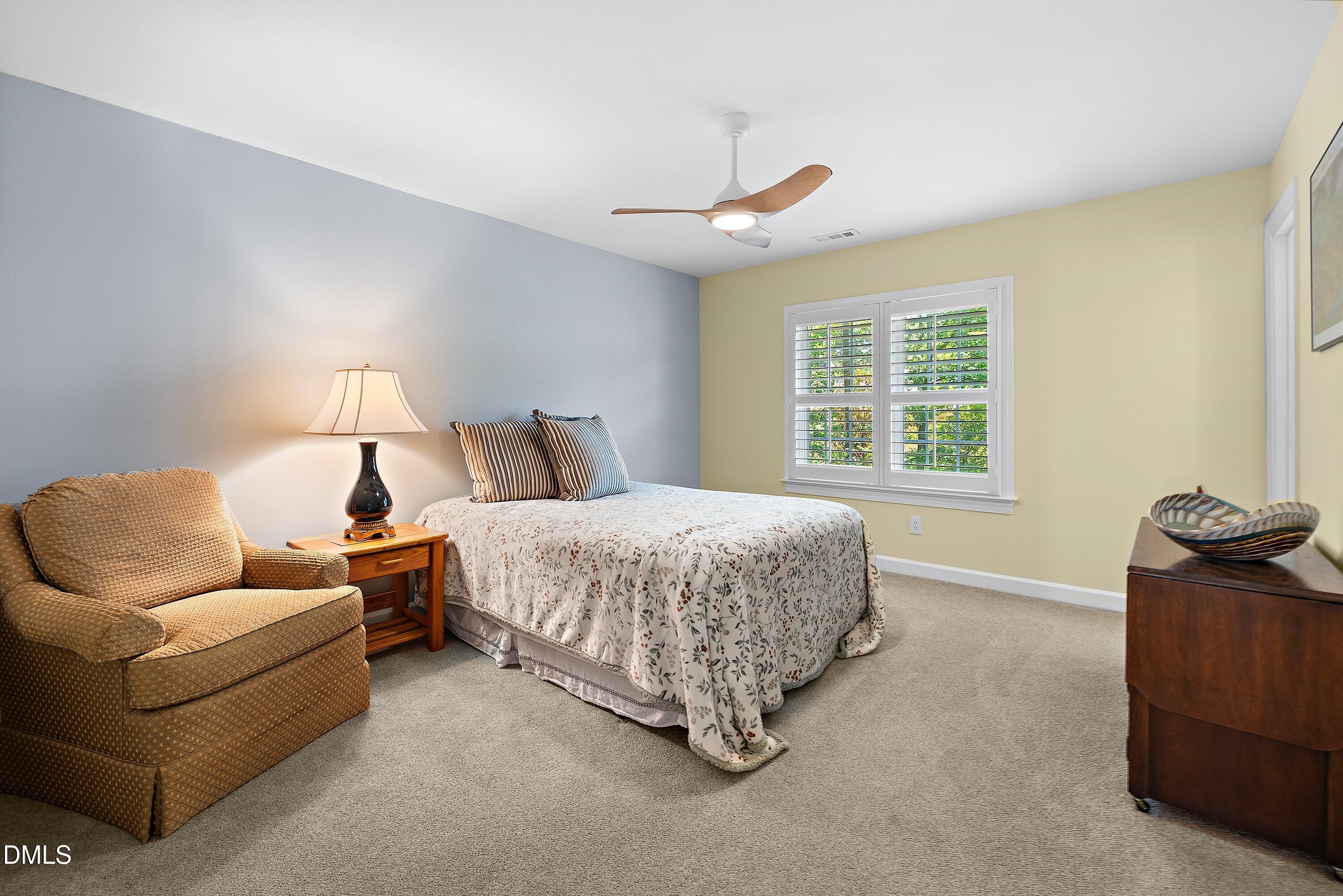 3608 Summer Leaf Court Raleigh, NC 27615 - Photo 38 of 63 a bedroom with a bed and window
