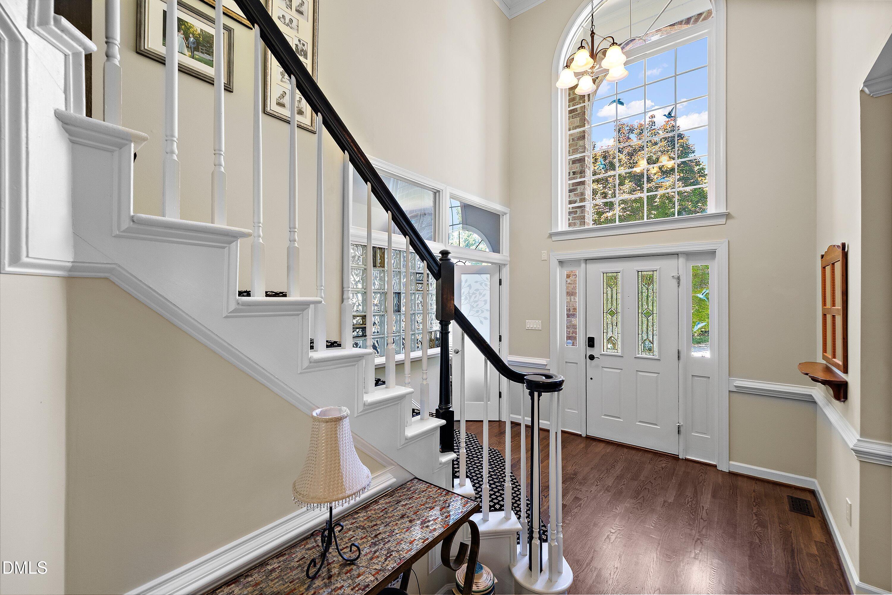 3608 Summer Leaf Court Raleigh, NC 27615 - Photo 4 of 63 a view of entryway with wooden floor and stairs