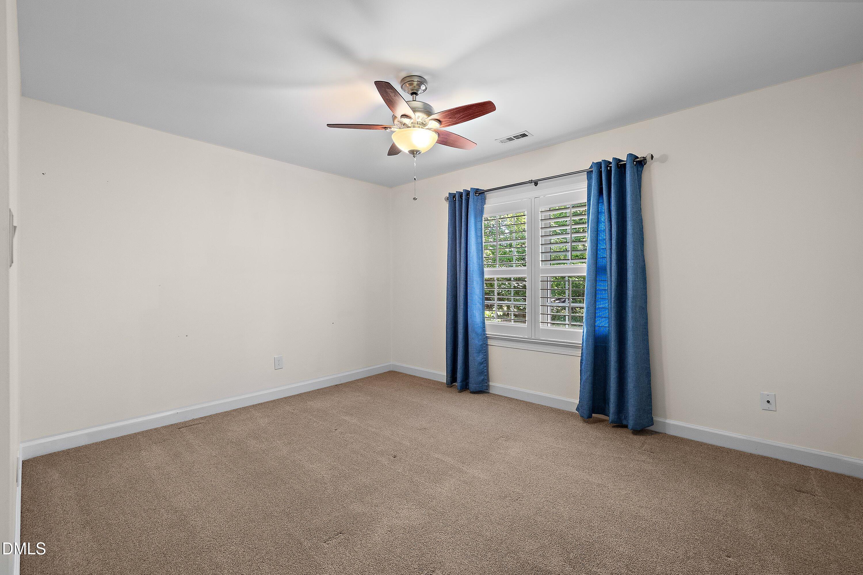 3608 Summer Leaf Court Raleigh, NC 27615 - Photo 44 of 63 a view of an empty room with a window