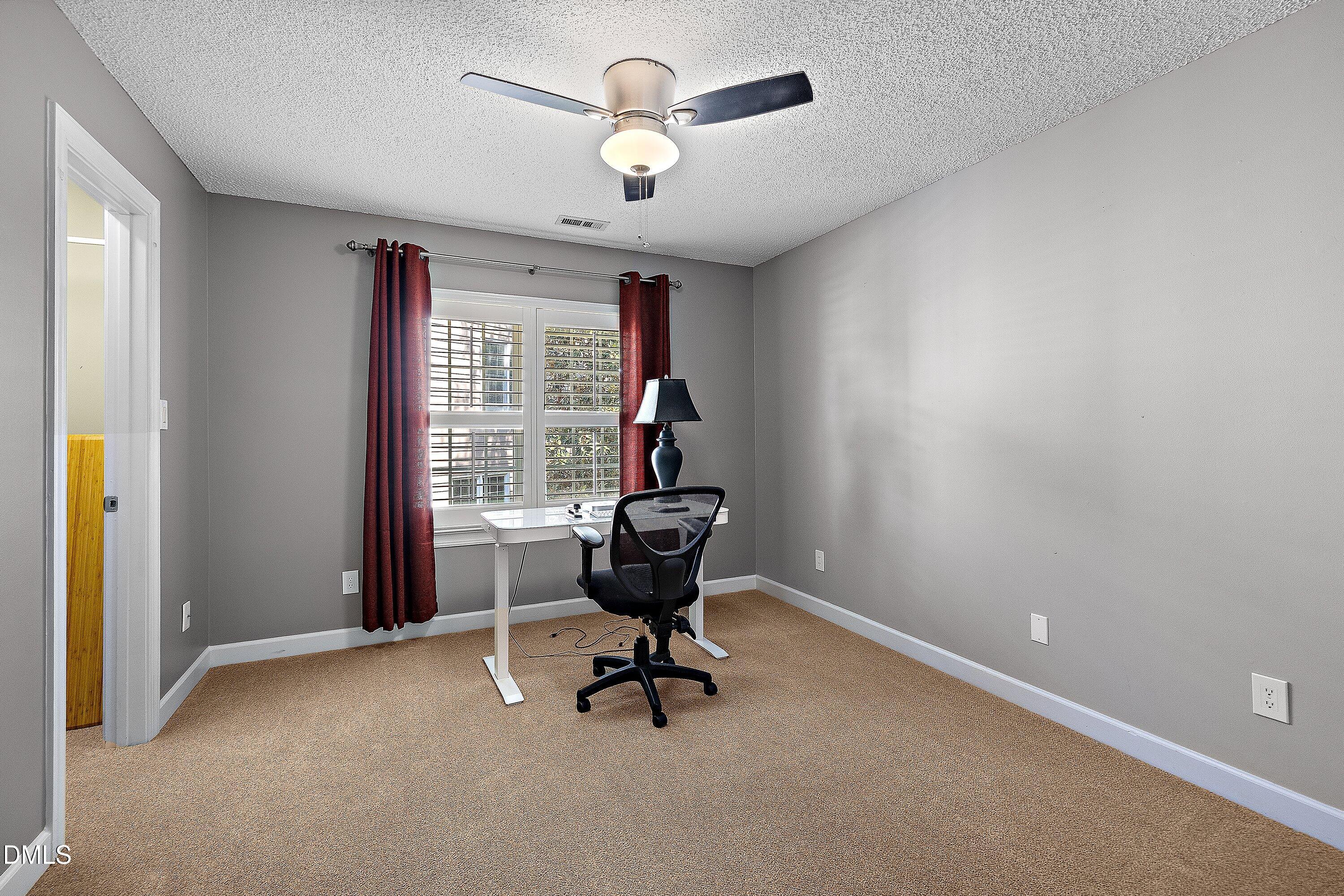 3608 Summer Leaf Court Raleigh, NC 27615 - Photo 45 of 63 a room with gym equipment and windows