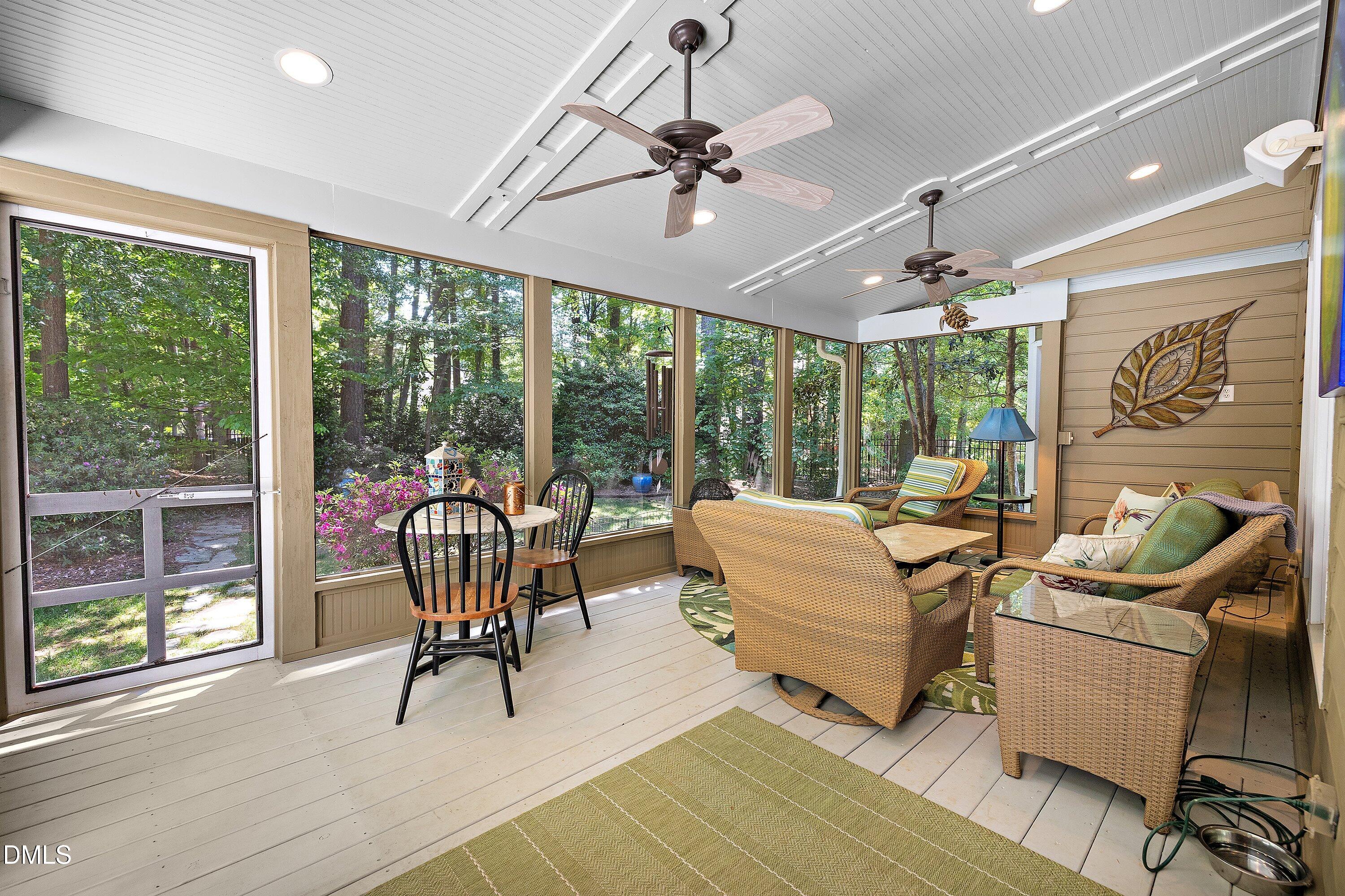 3608 Summer Leaf Court Raleigh, NC 27615 - Photo 50 of 63 a living room with patio furniture and a large window