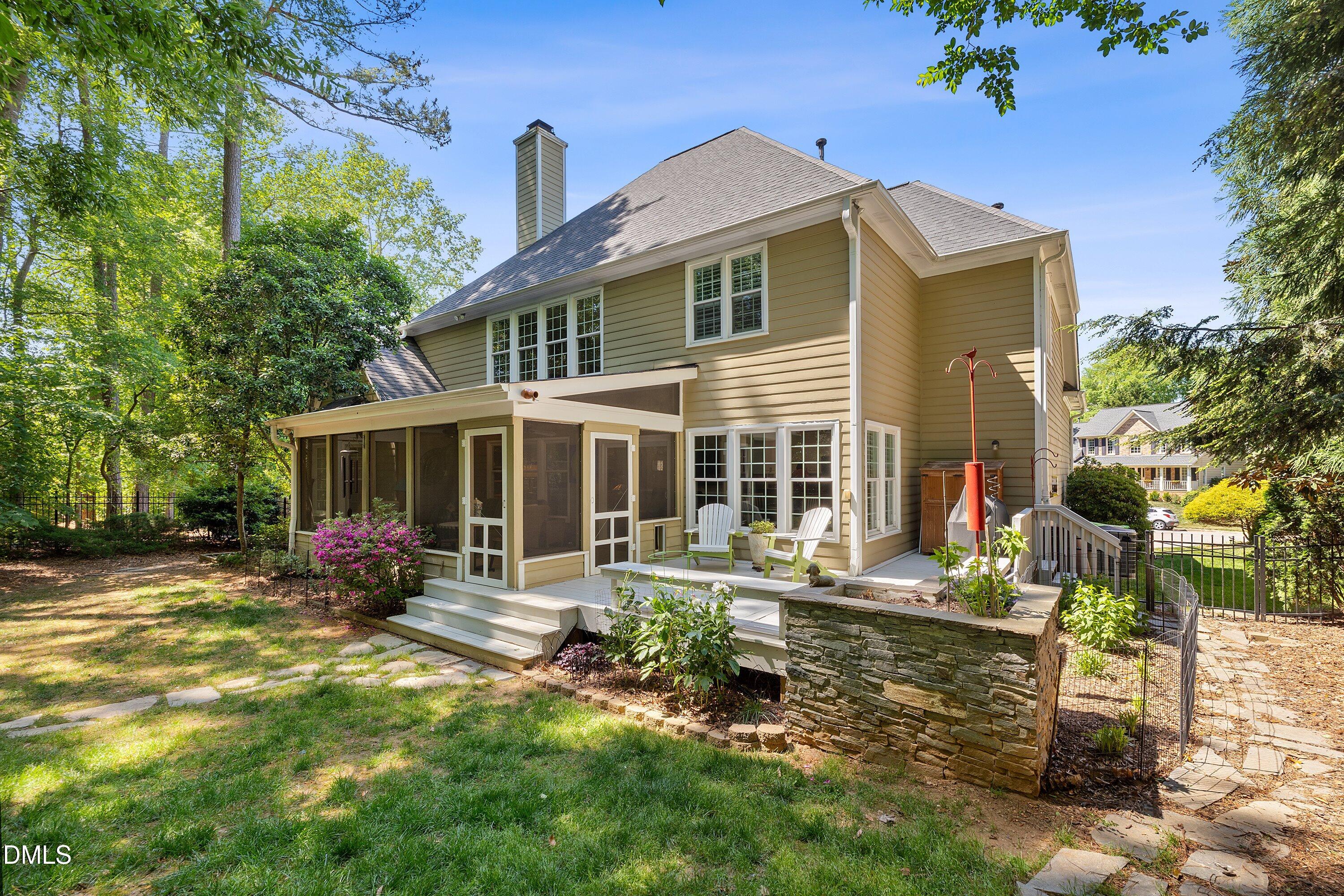 3608 Summer Leaf Court Raleigh, NC 27615 - Photo 53 of 63 a front view of house with yard outdoor seating and barbeque oven