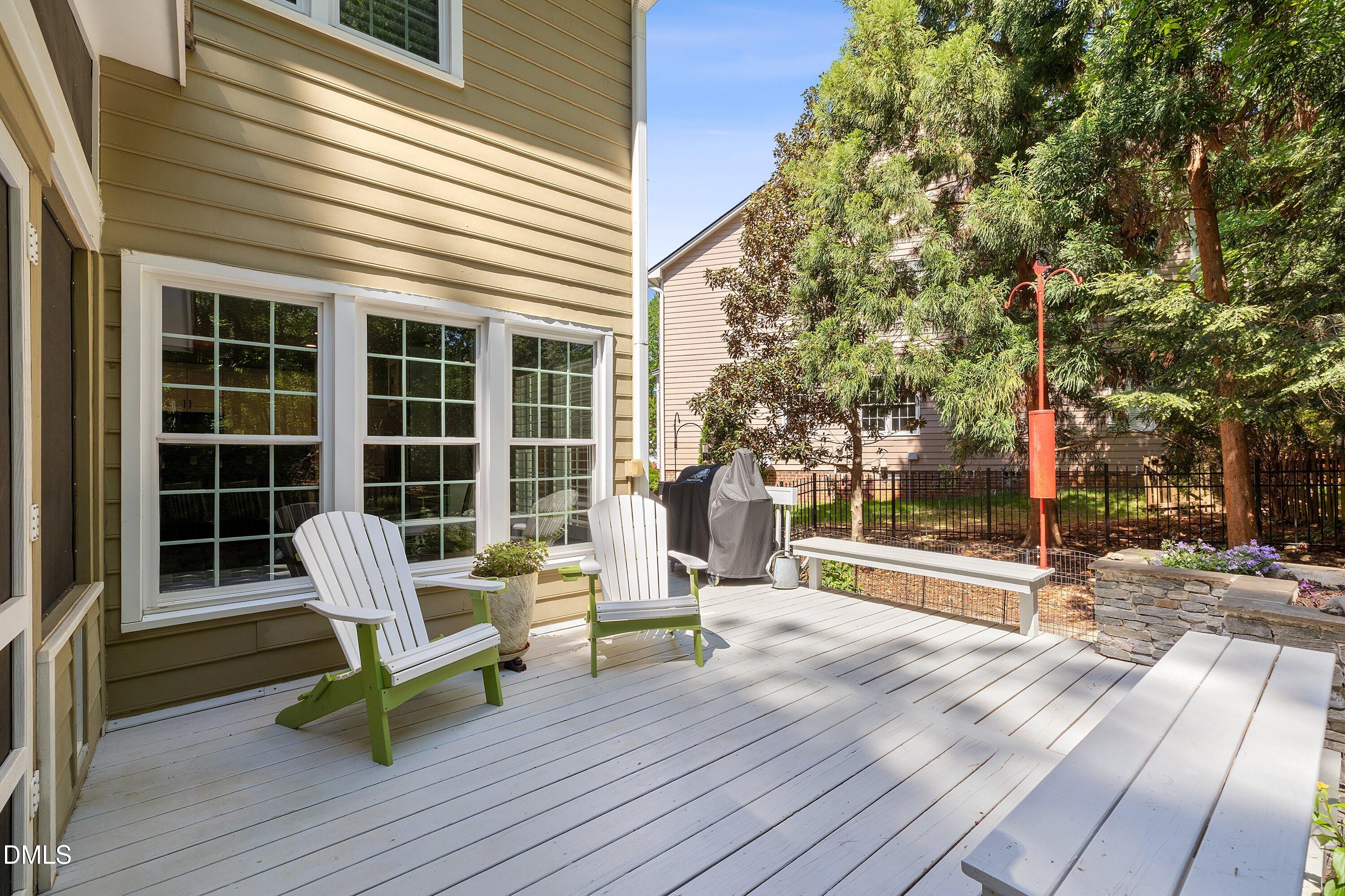3608 Summer Leaf Court Raleigh, NC 27615 - Photo 55 of 63 a view of a deck with chairs and wooden floor