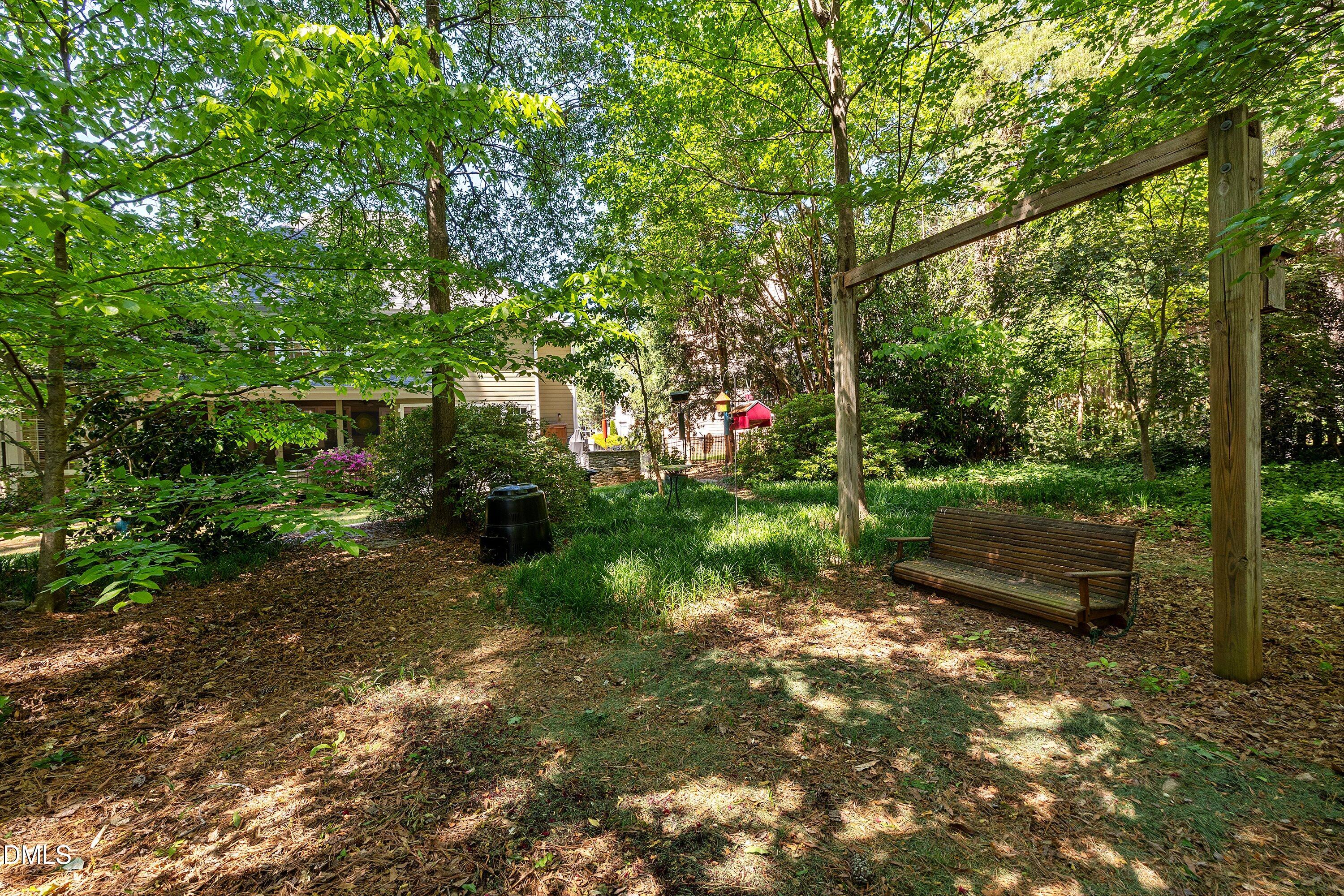 3608 Summer Leaf Court Raleigh, NC 27615 - Photo 62 of 63 a backyard of a house with lots of green space