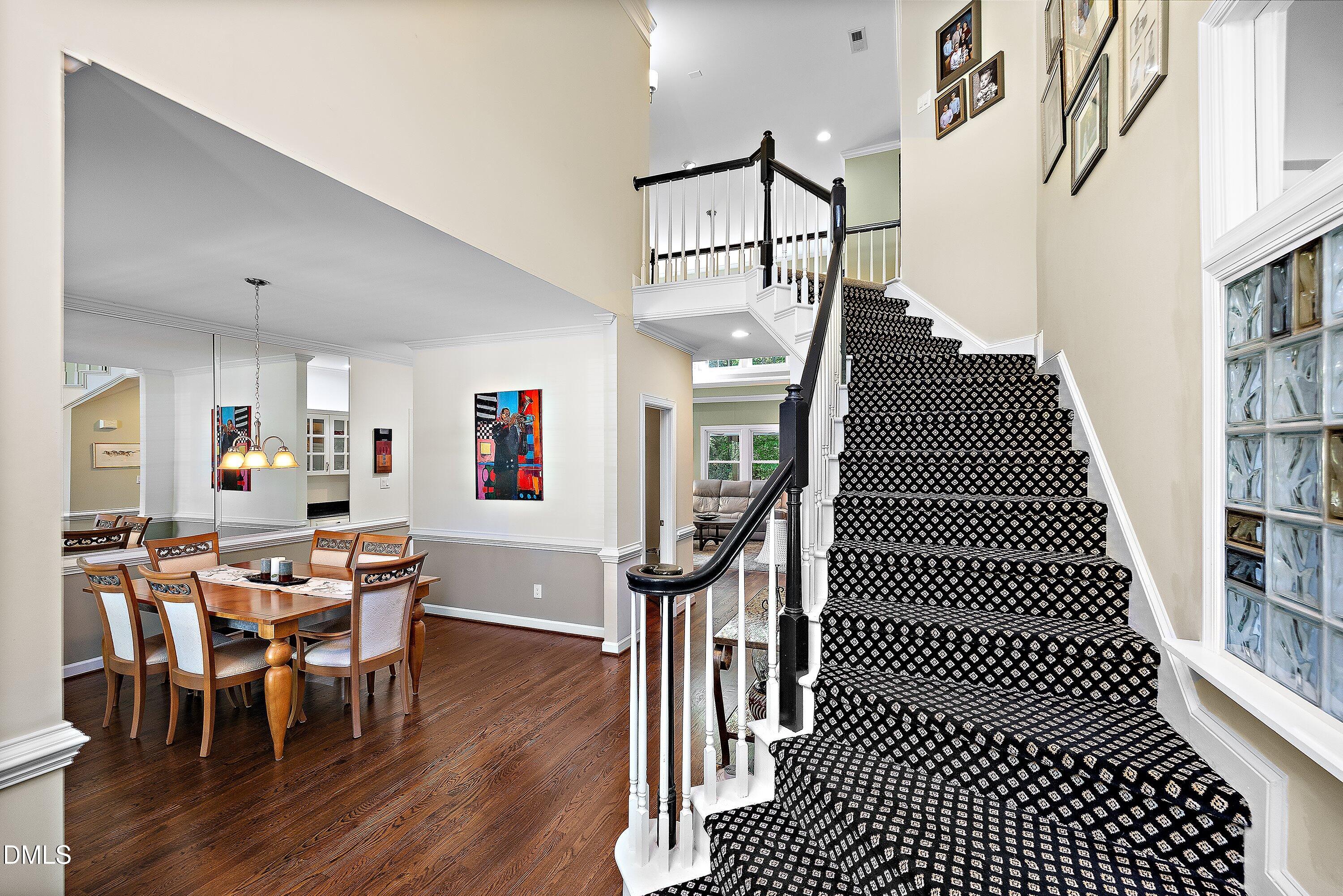3608 Summer Leaf Court Raleigh, NC 27615 - Photo 8 of 63 a view of a hallway with furniture and wooden floor