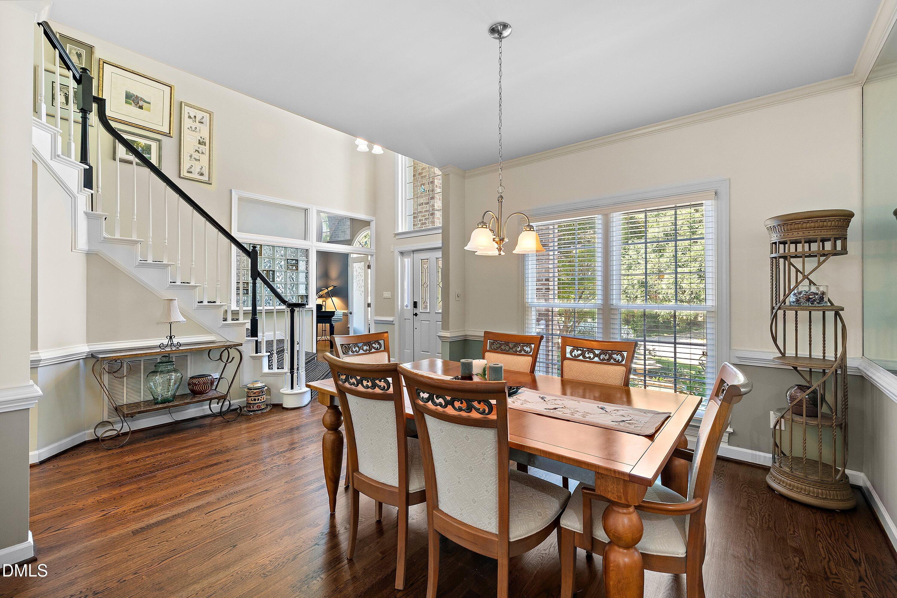 3608 Summer Leaf Court Raleigh, NC 27615 - Photo 9 of 63 a view of a dining room with furniture window and wooden floor