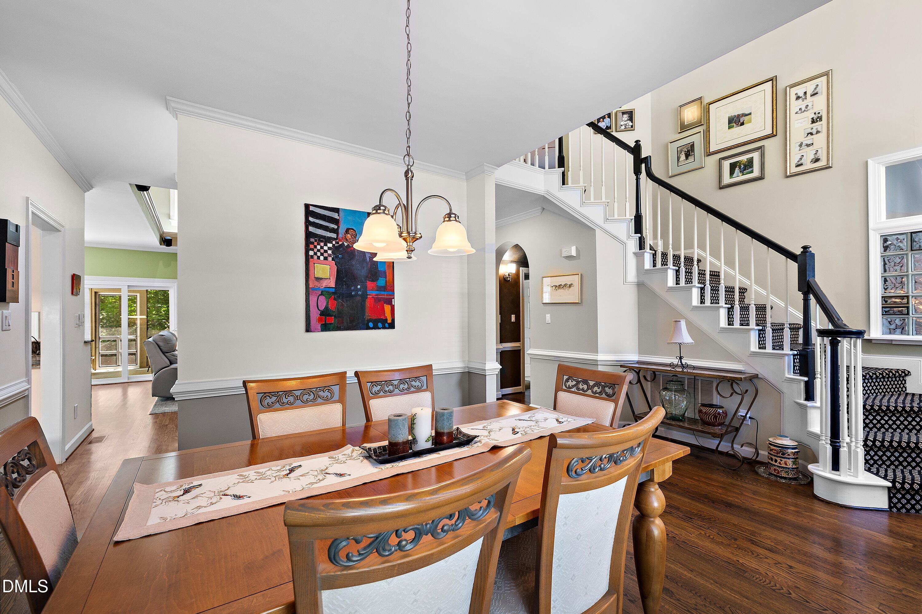 3608 Summer Leaf Court Raleigh, NC 27615 - Photo 10 of 63 a view of a dining room with furniture window and wooden floor