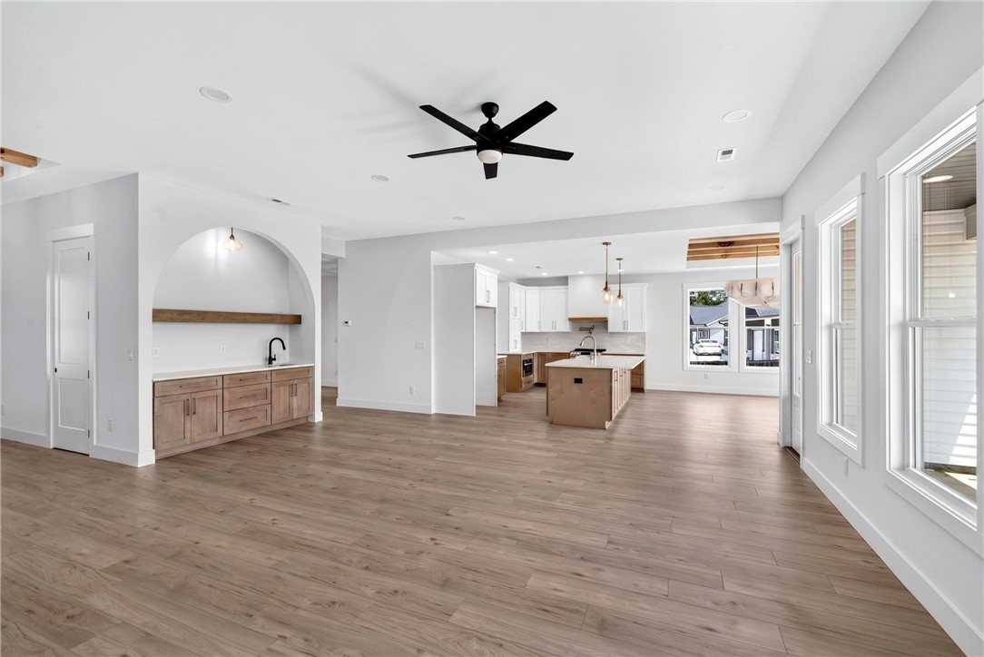 424 Blume Road Anderson, SC 29625 - Photo 8 of 30 An airy great room featuring wide plank flooring and a stylish built-in wet bar.