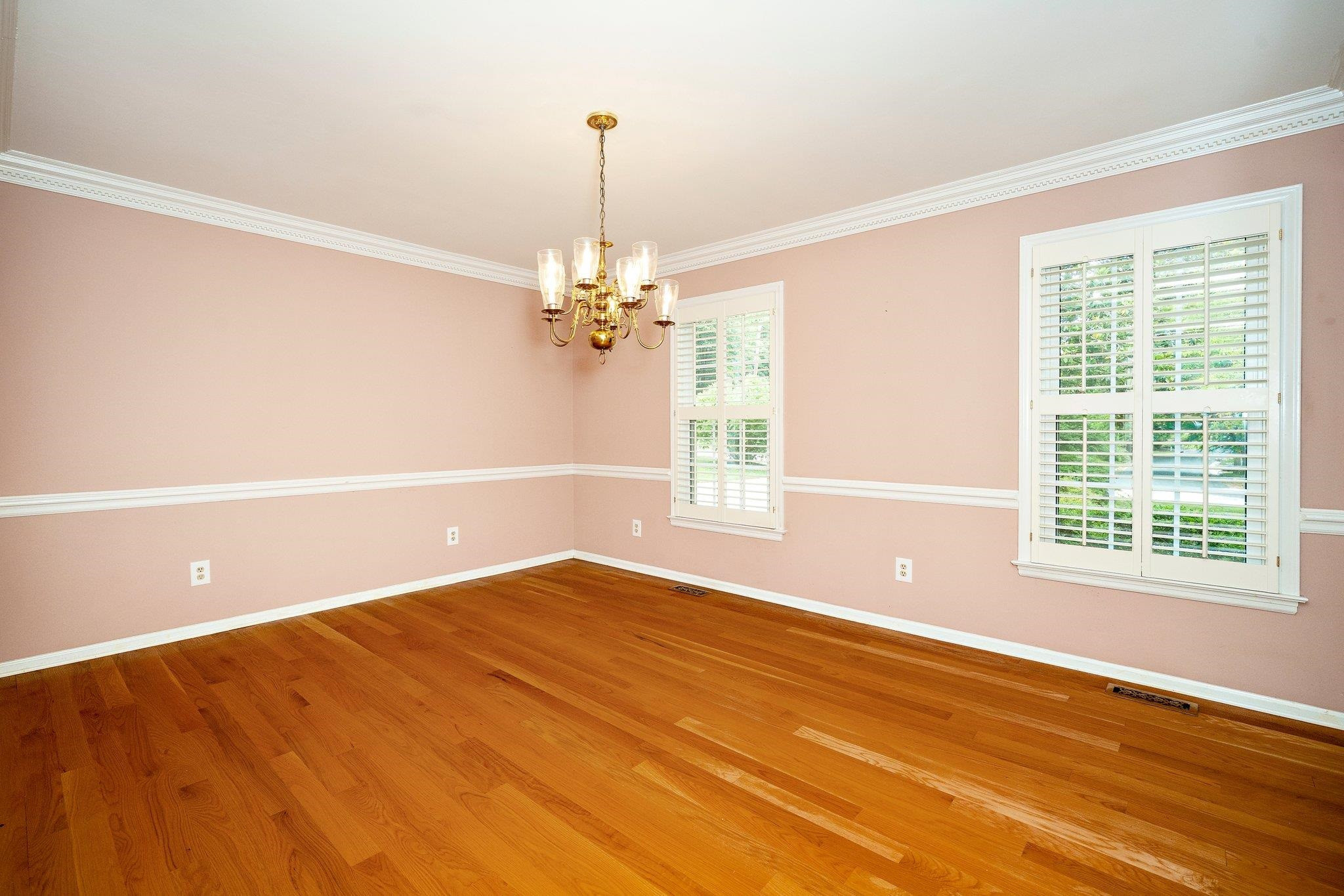 1512 Pony Run Road Raleigh, NC 27615 - Photo 11 of 39 Entertain Your Favorite Guests in this Spacious Dining Room complete with Plantation Shutters, Chairrail, Dentil Crown Molding, Hardwood Flooring and Smooth Ceiling. This will Make the Dining Space a Joy for Your Dinner Parties Dining Room